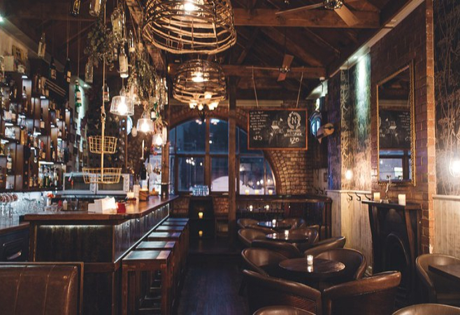 Black Pearl Whiskey Lounge offers a refined and cozy ambiance for whiskey enthusiasts and socialites alike