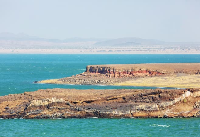 Lake Turkana is a saline lake in the Kenyan Rift Valley, in northern Kenya, with its far northern end crossing into Ethiopia.