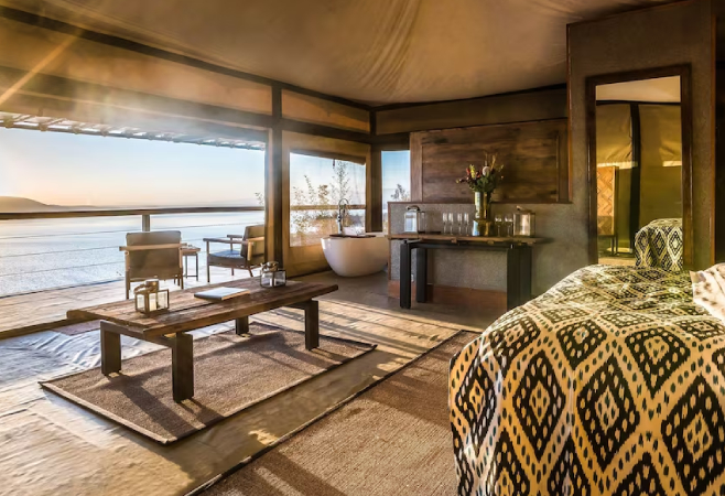 The Cliff is a luxury camp on a rock face with 180-degree views of Lake Nakuru, featuring ten spacious tented camps. The Cliff is a luxury camp on a rock face with 180-degree views of Lake Nakuru, featuring ten spacious tented camps.